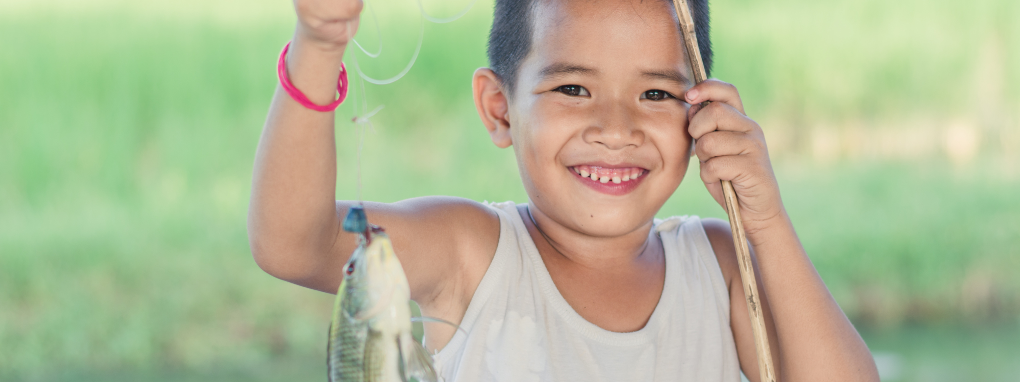 Little Boy Holding FIsh